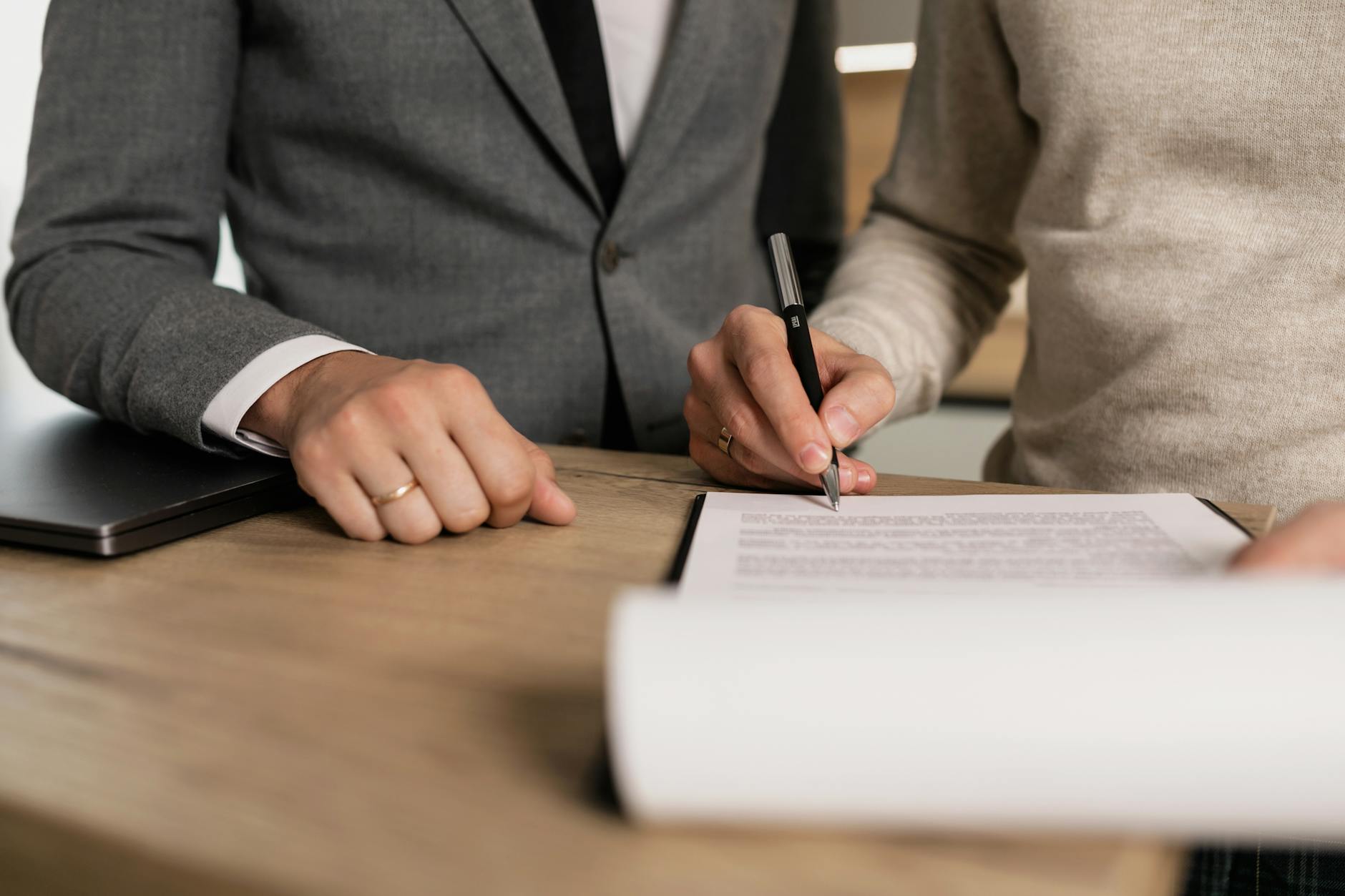 a person signing a contract